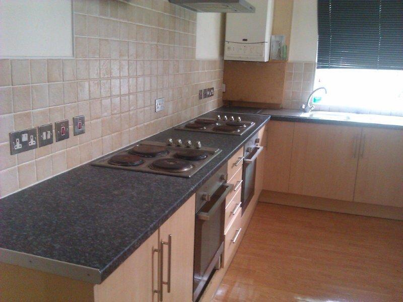 A bright and well-maintained kitchen with moder...