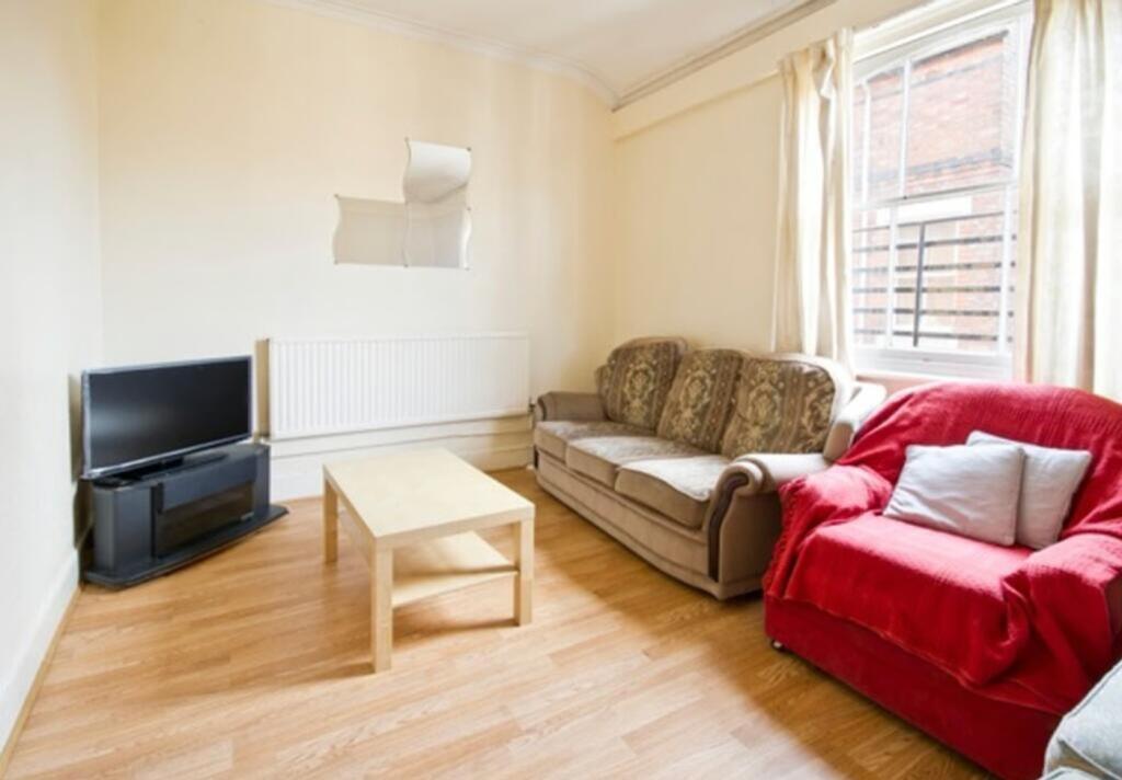 A bright and inviting living room with ample sp...