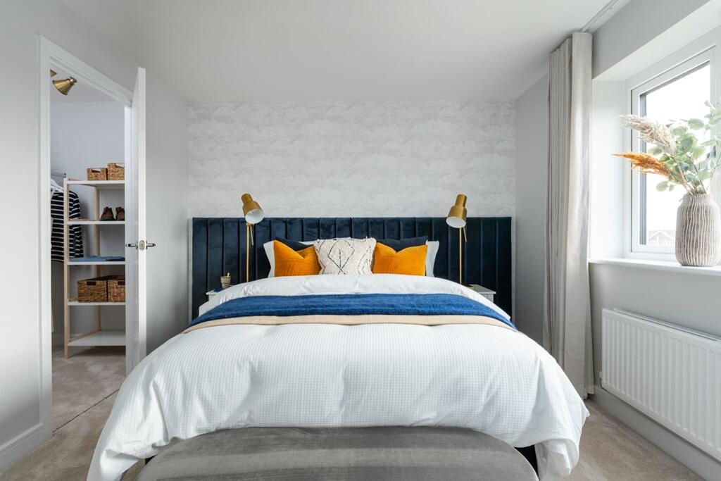 The main bedroom is complete with a walk-in wardrobe and ensuite