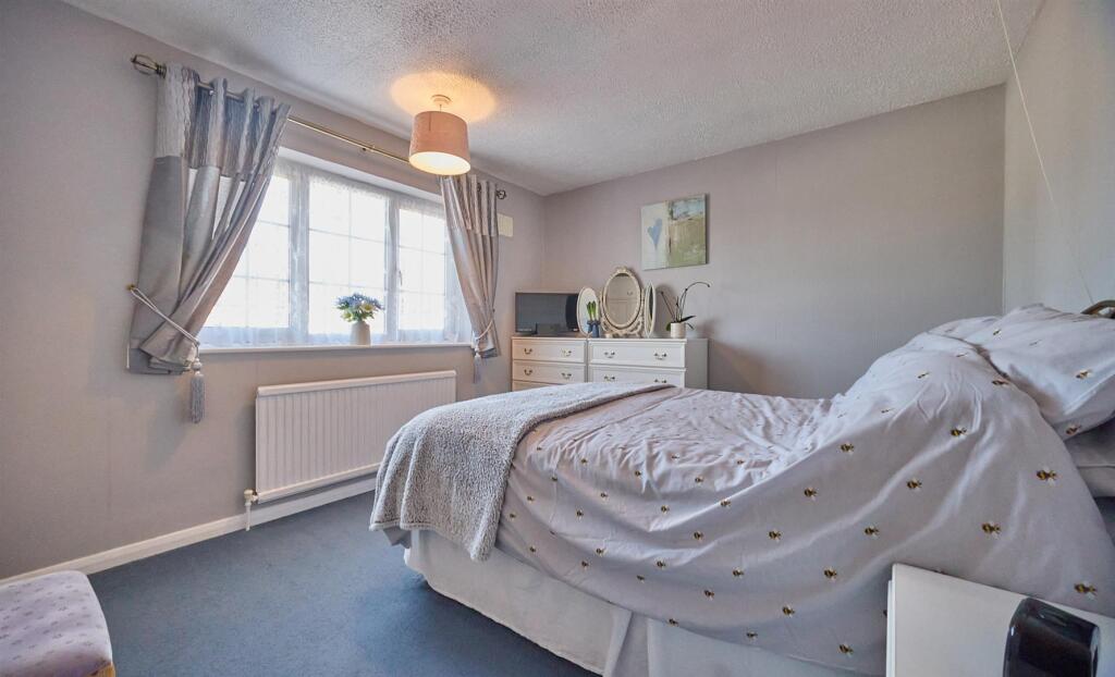 BEDROOM ONE TO FRONT