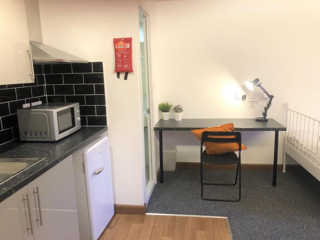 A compact and well-maintained student room feat...