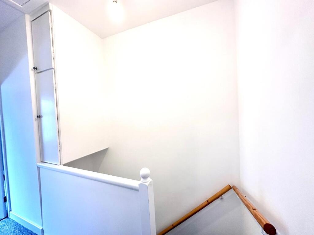 TO THE FIRST FLOOR LANDING