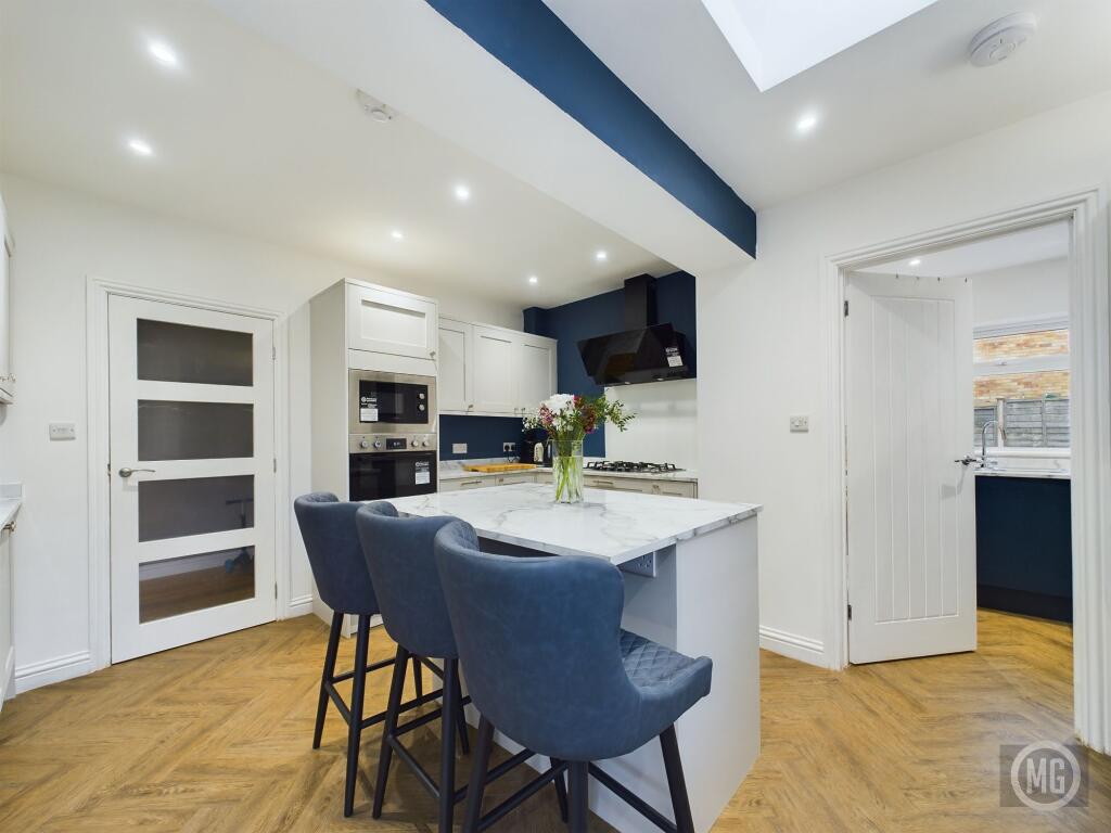 Kitchen leading into Utility