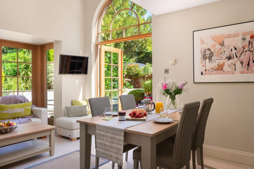 Kitchen Dining Room Arched Window into Garden