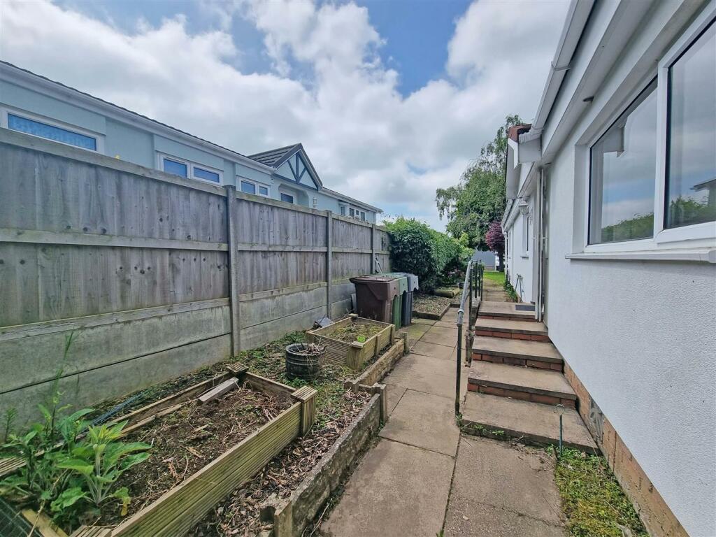 FRONT SIDE AND REAR GARDENS