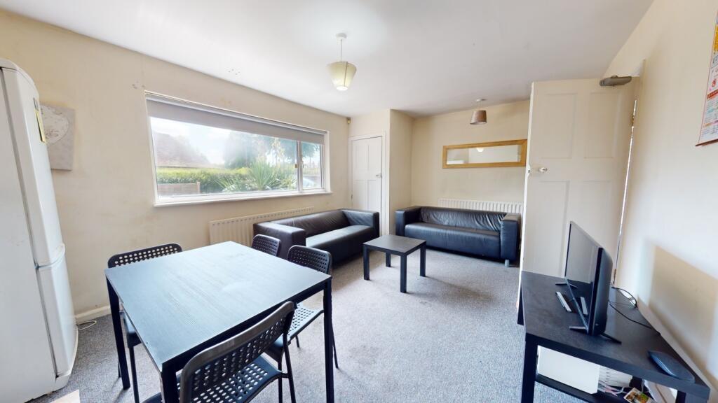 A bright and inviting living room featuring a l...