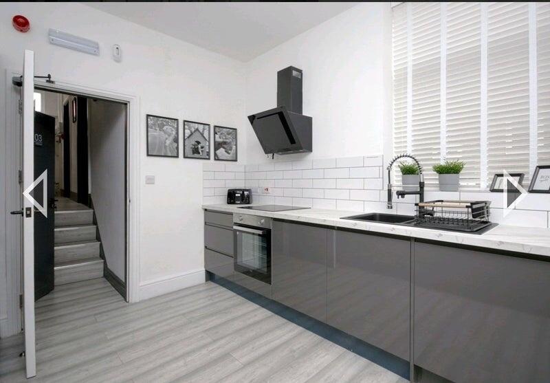 Modern and sleek kitchen with ample counter spa...