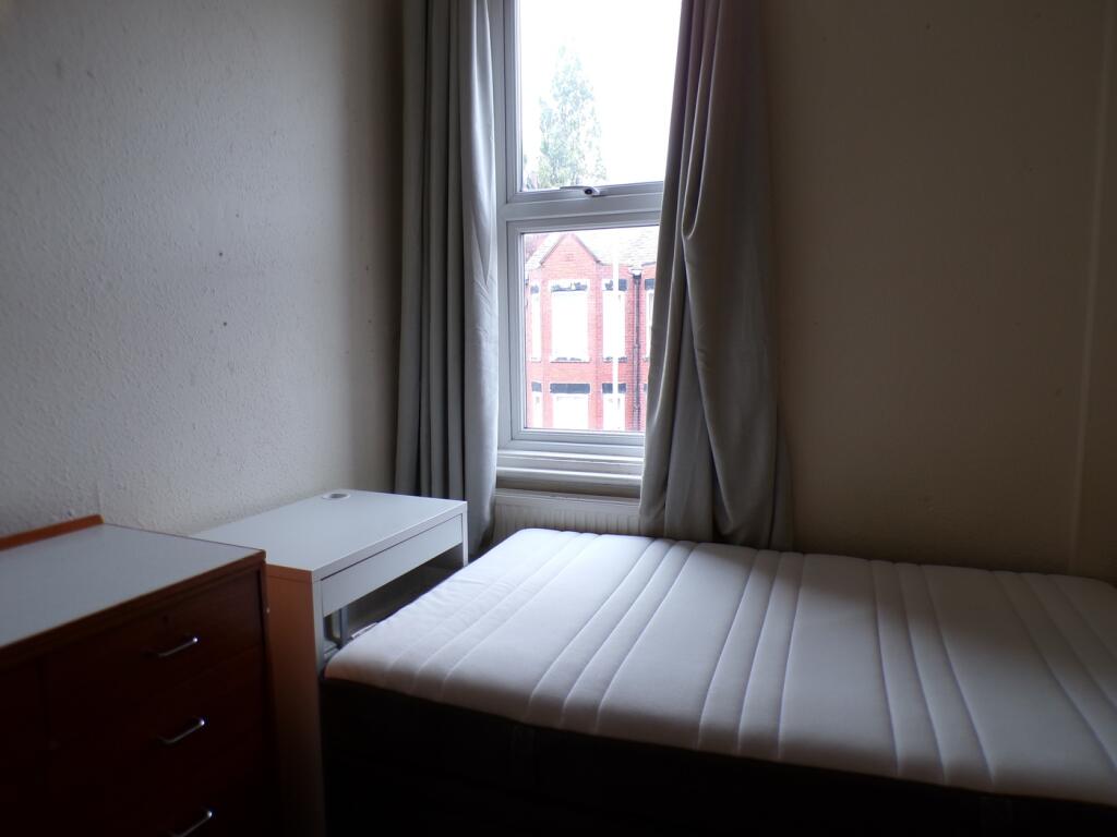 A tidy and well-lit double bedroom, perfect for...