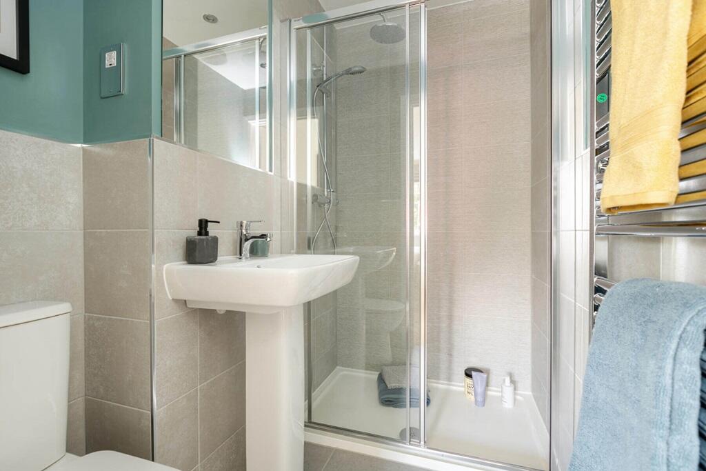 Bedroom 1 also hosts a private en-suite shower room