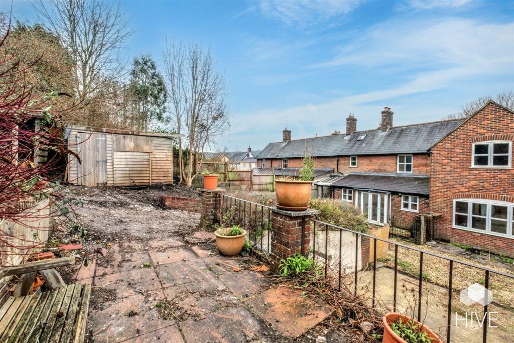 Rear garden with parking below