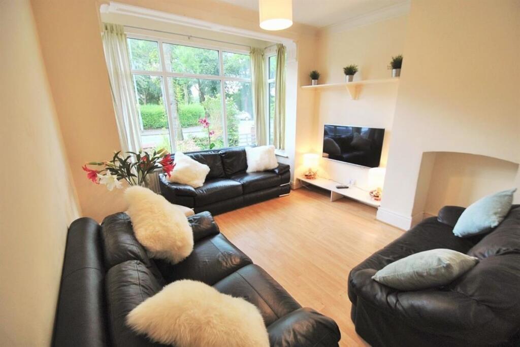 Bright, welcoming lounge with large front windo...