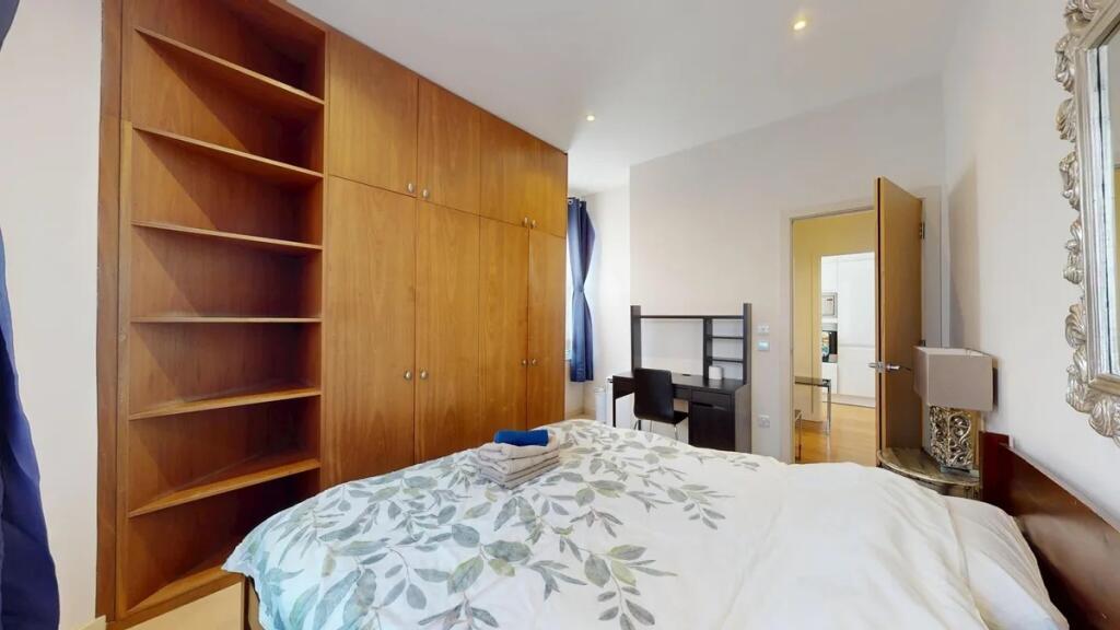 Bright and cozy double bedroom featuring a larg...