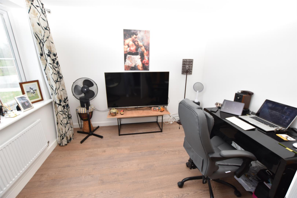 HOME OFFICE/PLAYROOM (FRONT)