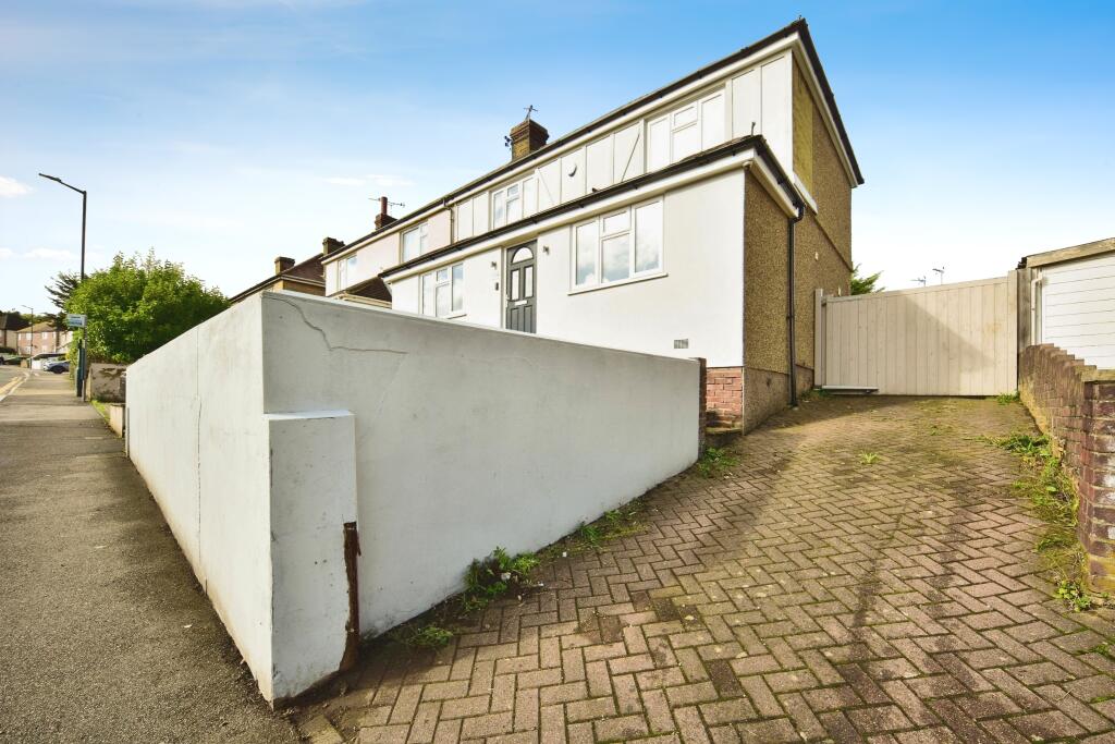 Outside View Of The Property With Driveway Parking