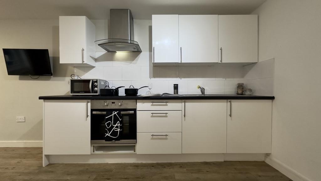 A modern and well-maintained kitchen with sleek...