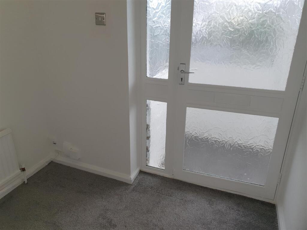 ENCLOSED STORM PORCH