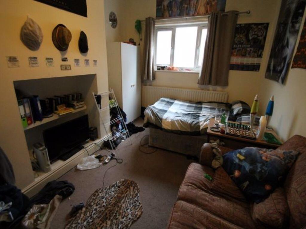 Cozy single bedroom featuring a comfortable sin...