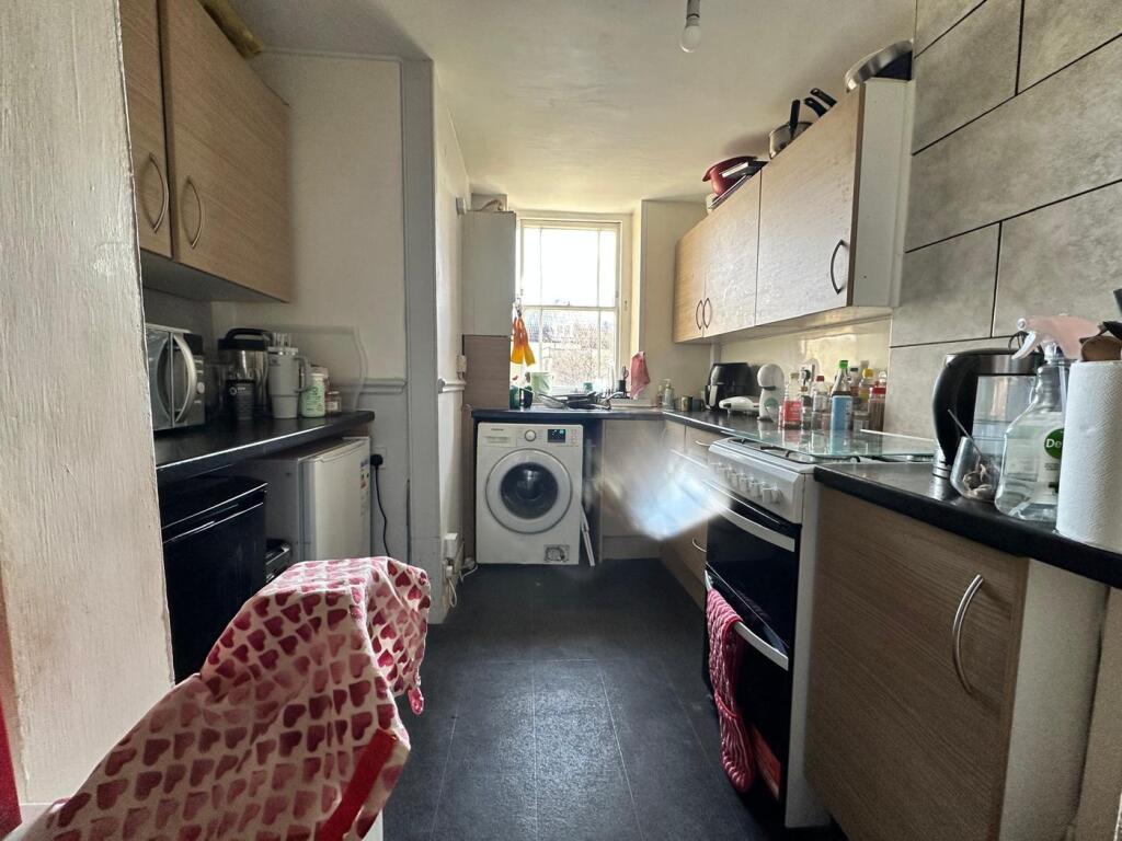 A bright and functional kitchen featuring a ran...