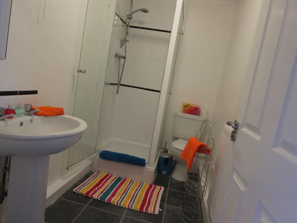A clean and functional bathroom featuring a sin...