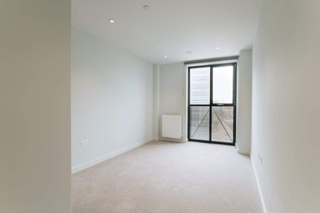 Embrace the simplicity and elegance of this bright, sunlit room.