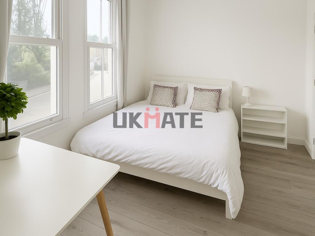 Bright and inviting double bedroom featuring a ...