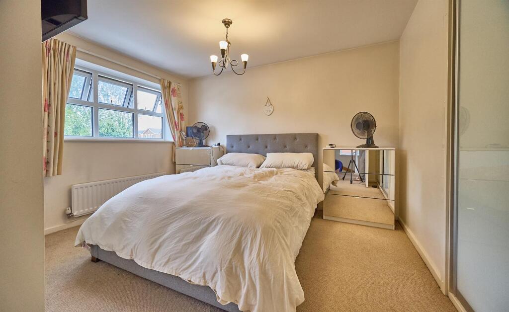 BEDROOM ONE TO FRONT