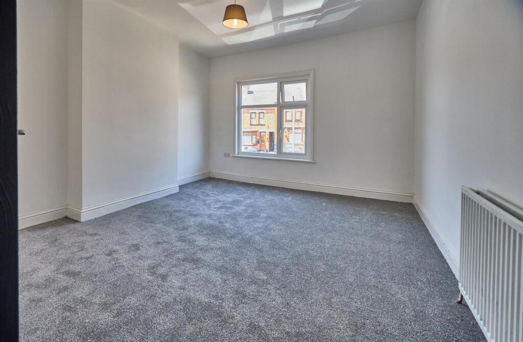 BEDROOM ONE TO FRONT