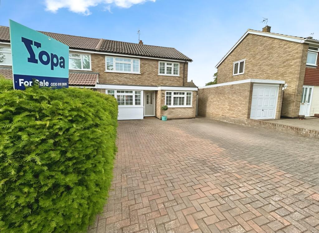 Front View Of The Property With Driveway Parking