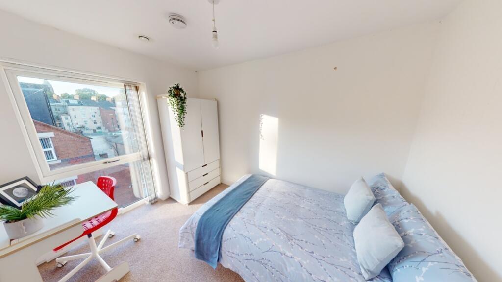 Bright and airy double bedroom featuring a comf...
