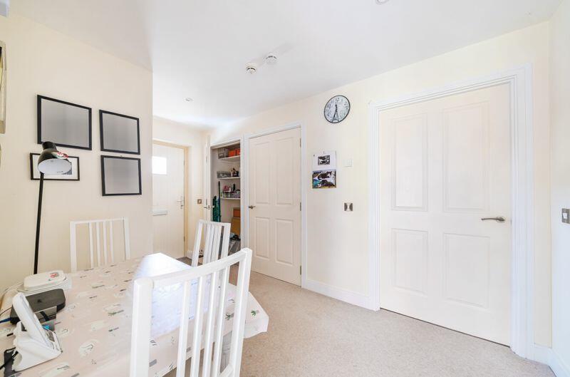 Hallway with storage cupboards