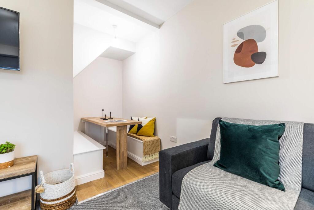 Bright, modern living area with a comfortable a...