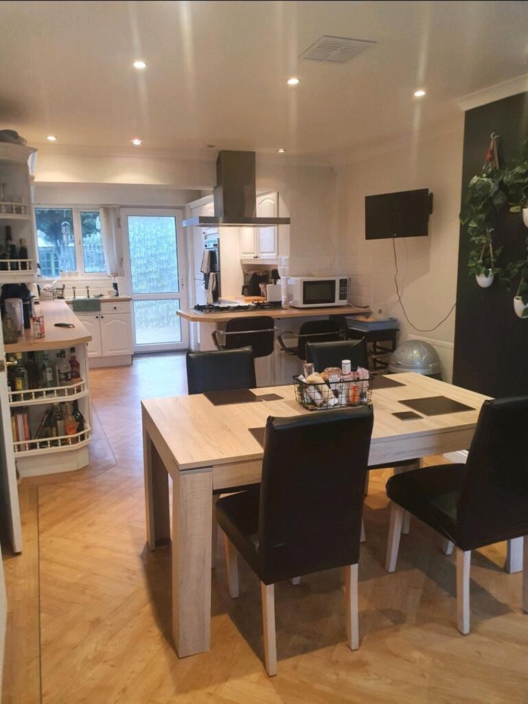 A spacious and inviting kitchen area with plent...