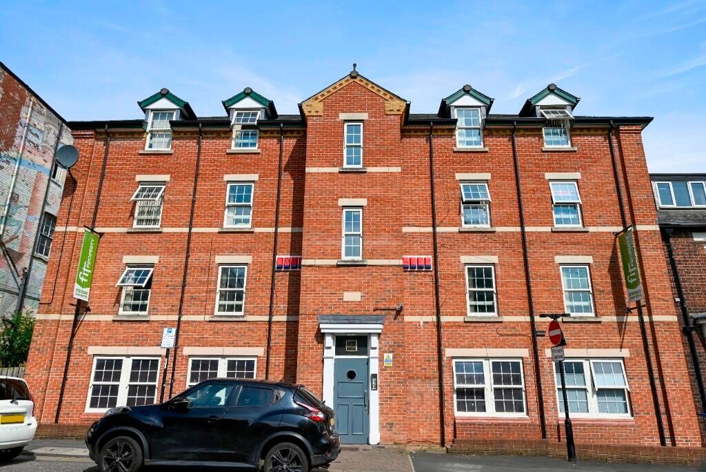 A well-maintained traditional red brick terrace...
