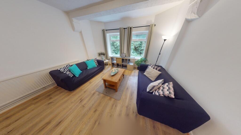 Bright and welcoming living room featuring ligh...