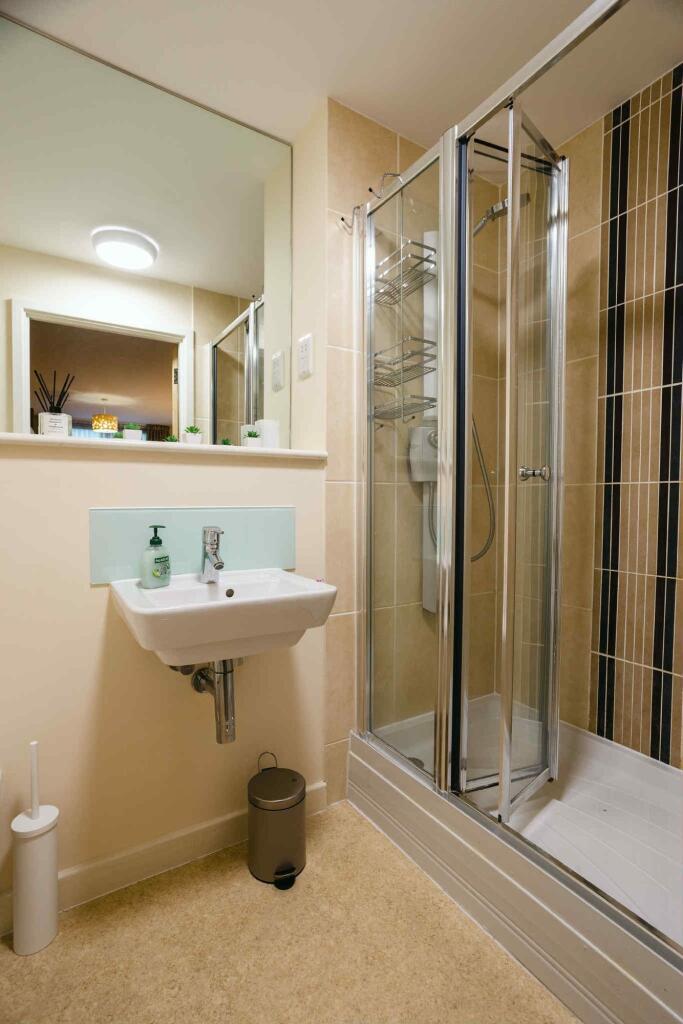 A modern bathroom featuring a clean sink with h...