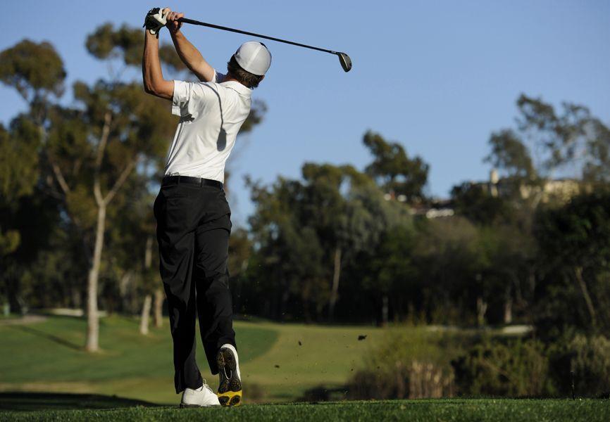 Man playing golf