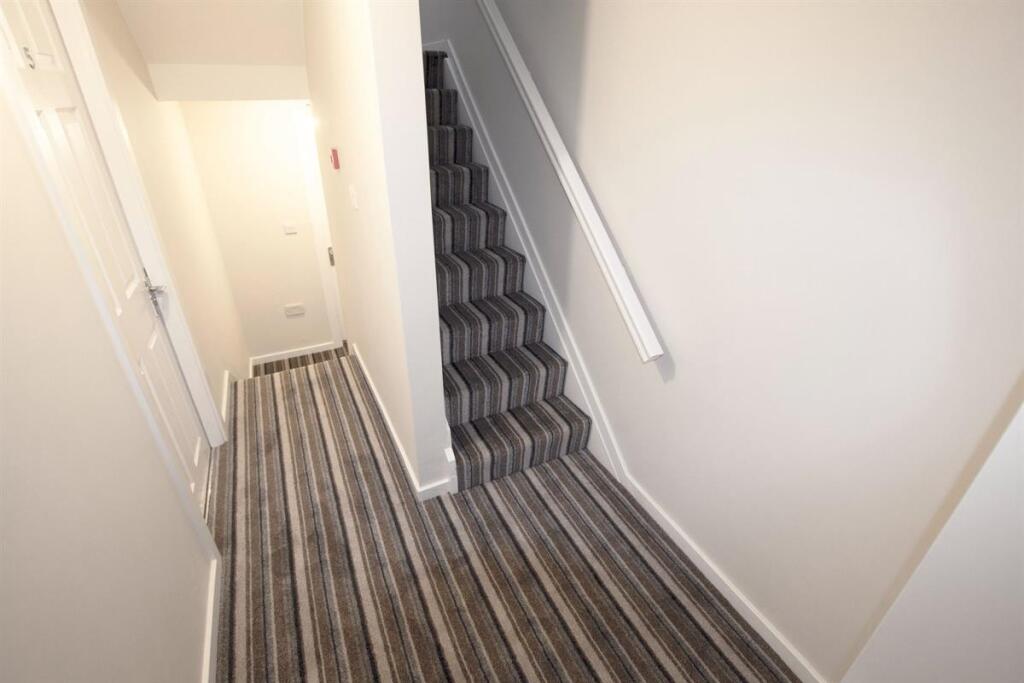 Bright, freshly decorated hallway and staircase...