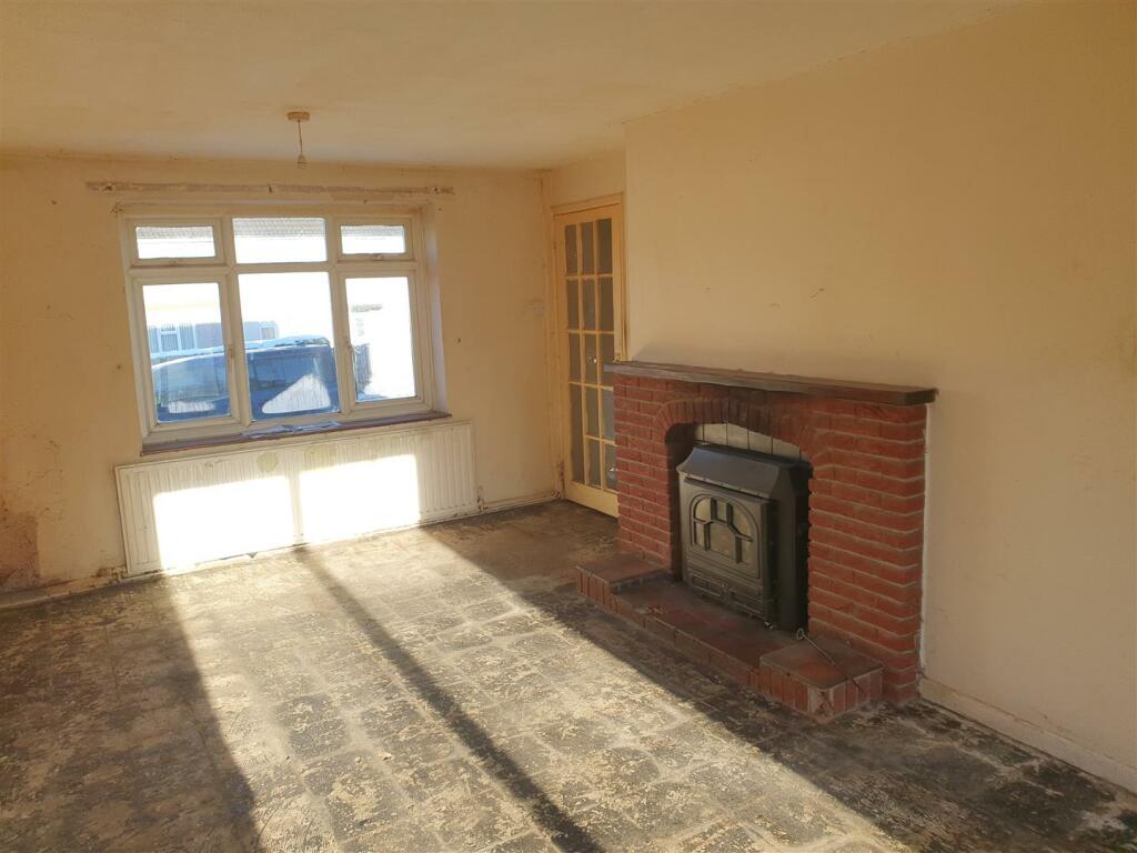 THROUGH LOUNGE/DINING ROOM