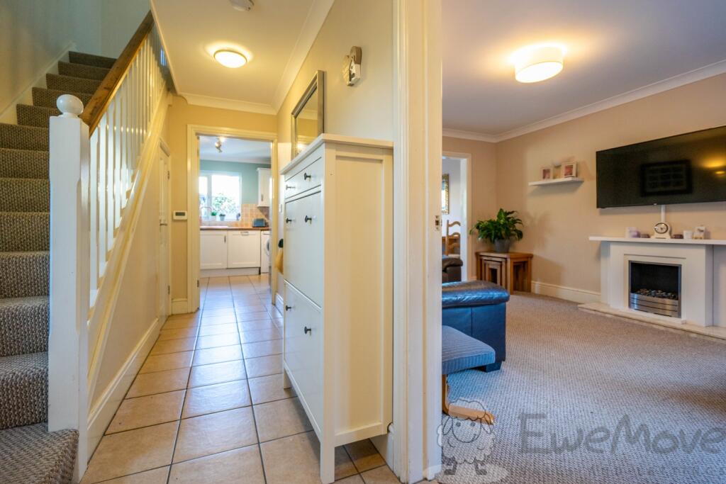 Entrance Hall with WC Storage and Under Floor Heat