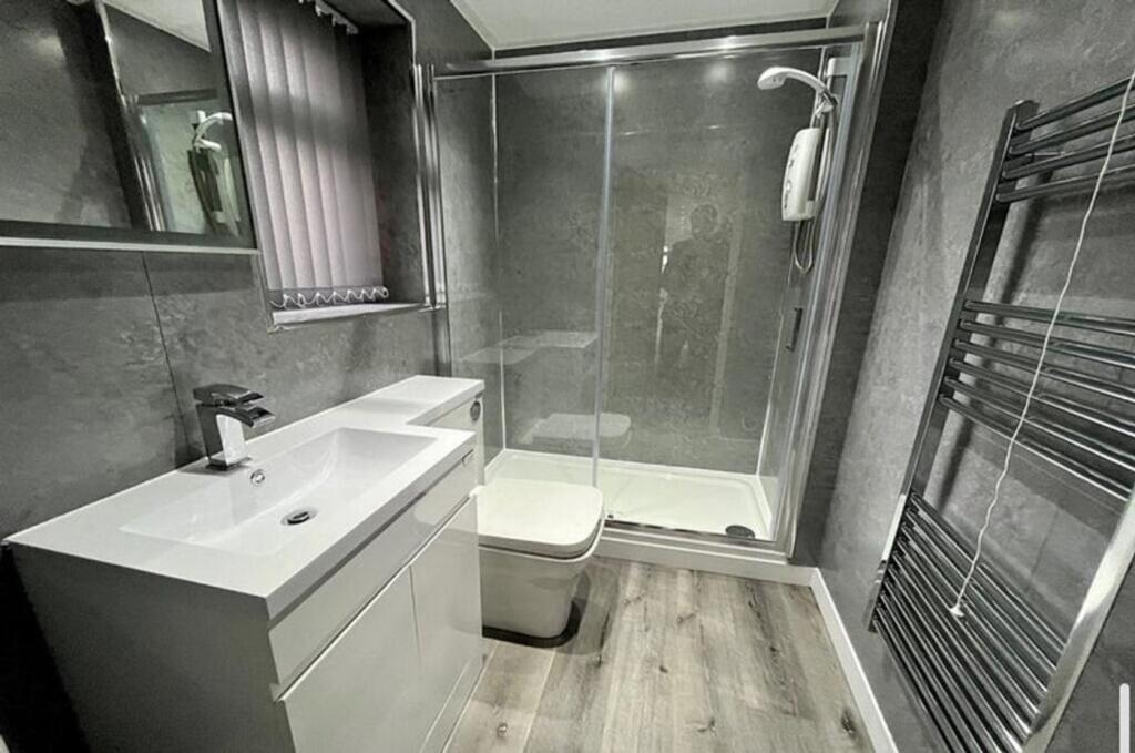 Stylish and modern bathroom suite featuring a s...