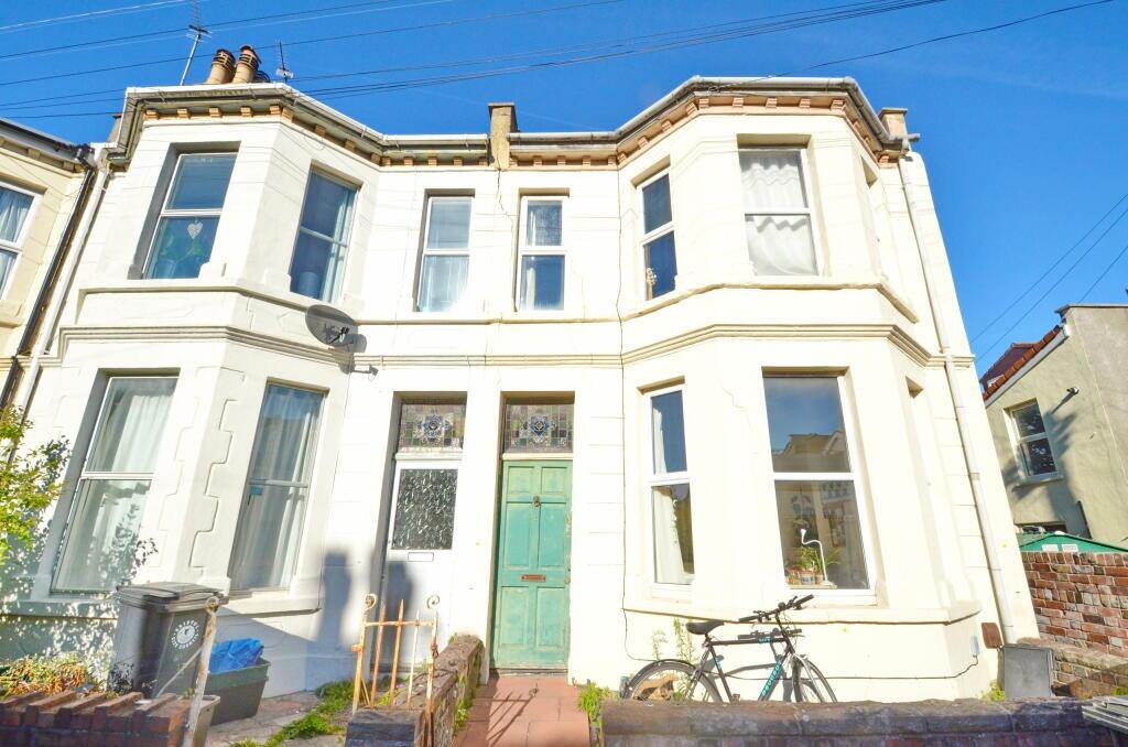 Bright and charming exterior of a classic terra...