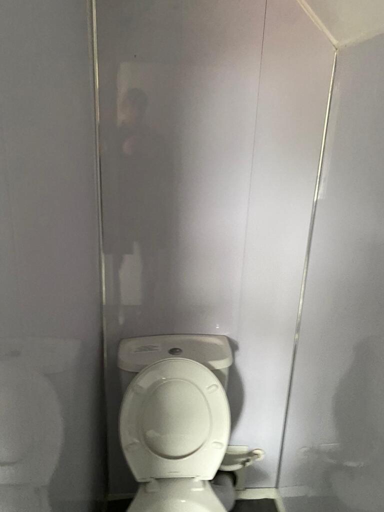 Compact and simple single toilet space with cle...