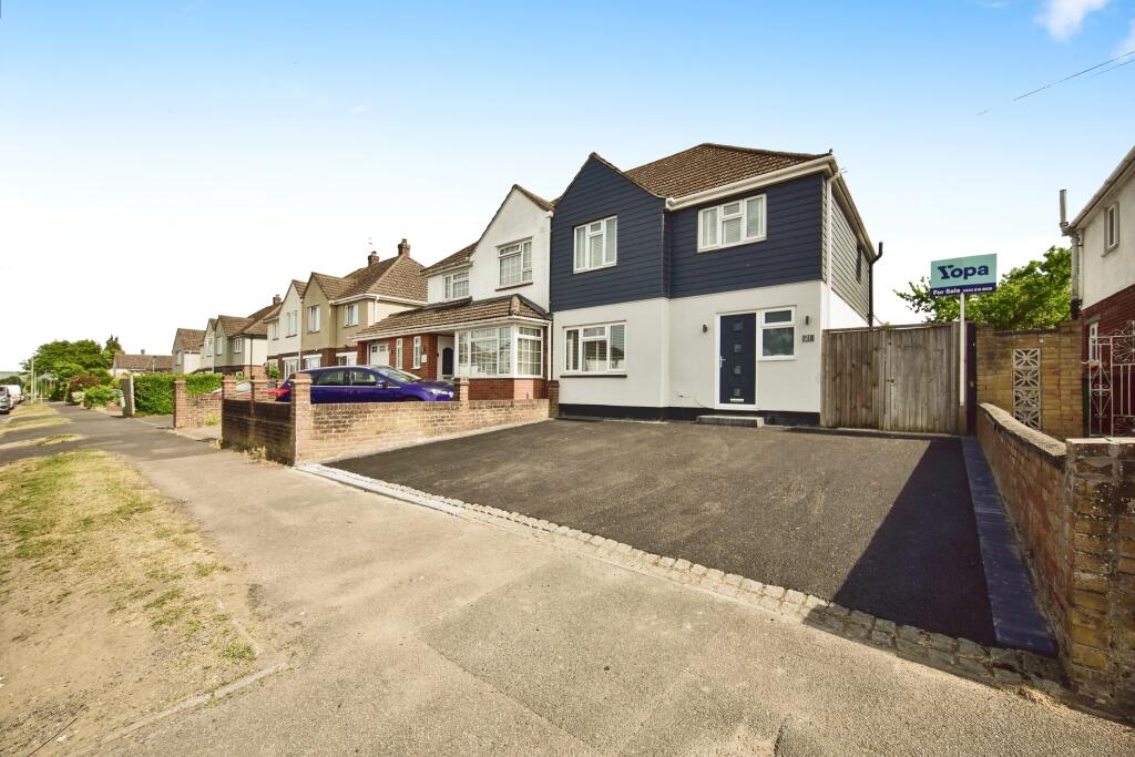 Outside View Of The Property With Driveway Parking