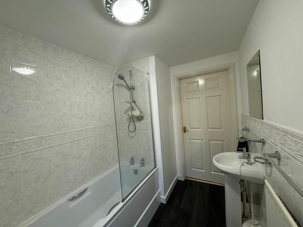 Bathroom with shower over bath