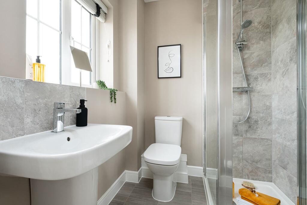 The window floods the en-suite with natural light