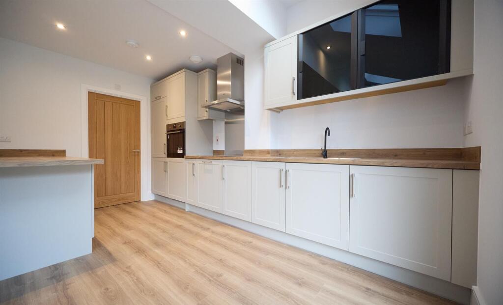 Open plan kitchen diner to rear