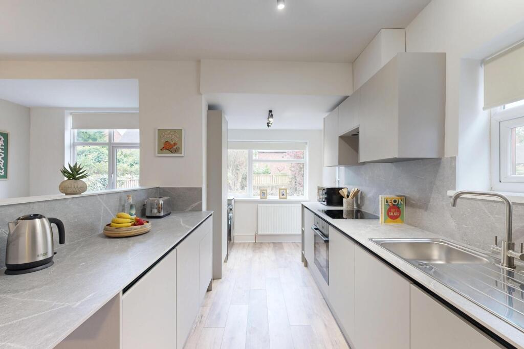 Modern and bright kitchen with ample counter sp...