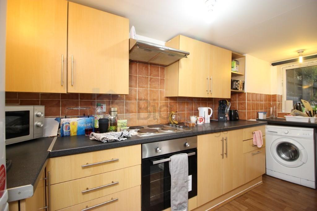 A neat and functional kitchen featuring wooden ...
