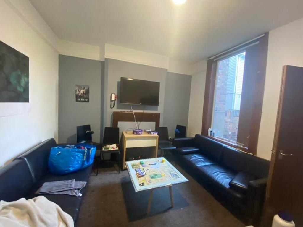 A spacious and inviting large modern living roo...