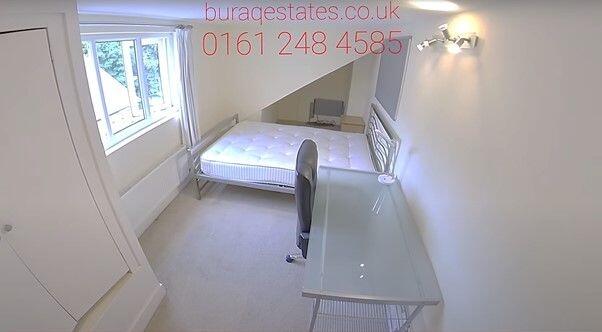 Bright, simply furnished bedroom with a comfort...